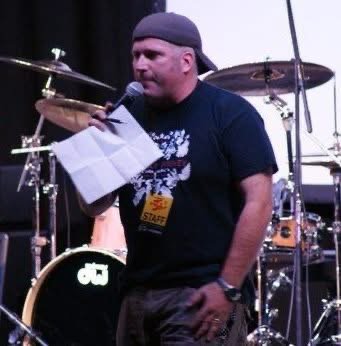 Chris on stage with microphone